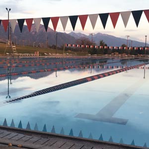 A swimming pool with flags.