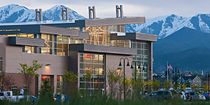 A building with a mountain in the background.