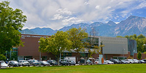 A parking lot with cars and trees.