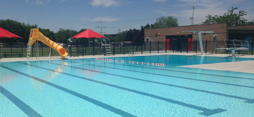 A swimming pool with a slide.